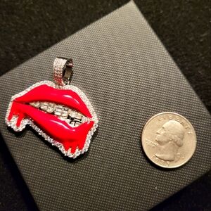 Iced and red enamel drippy lips pendant